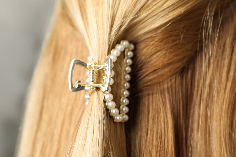 Woman's long hair held back in a decorative claw clip