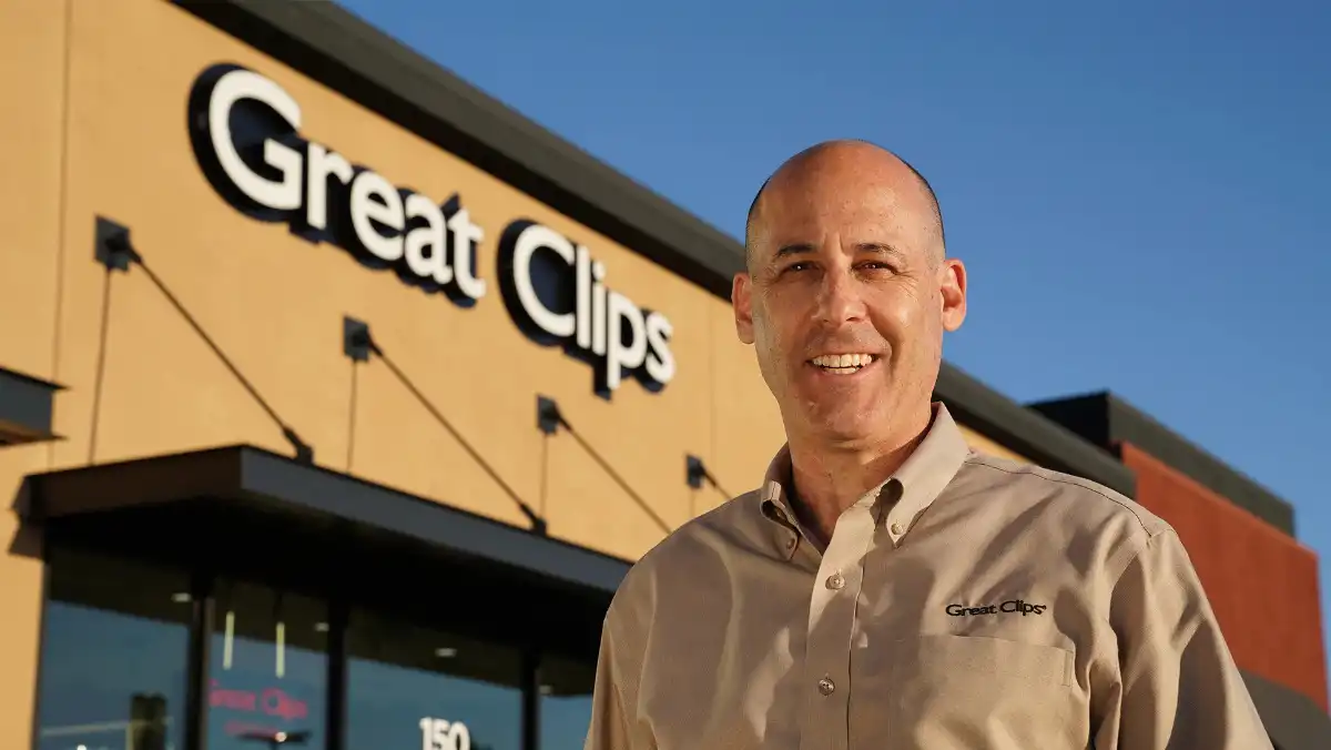 Franchisee standing in front of his Great Clips salon