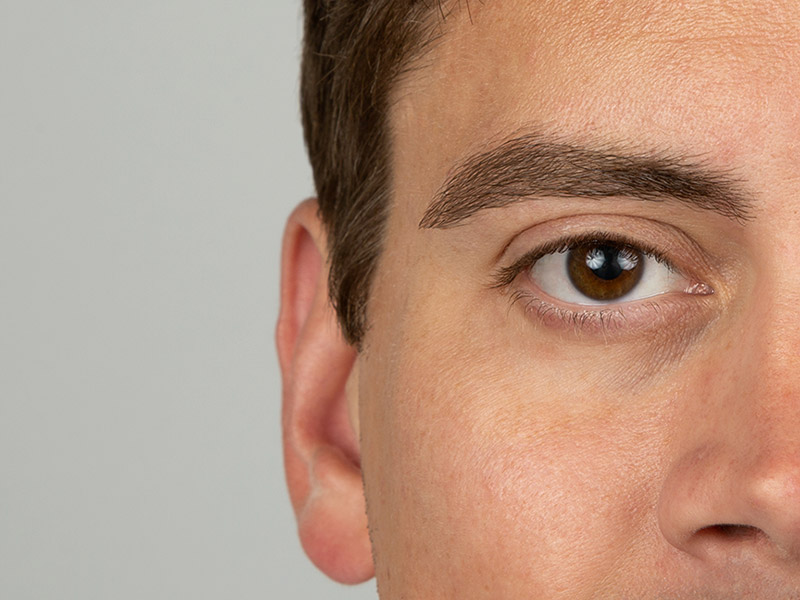 Close-up of a man’s well-groomed eyebrow