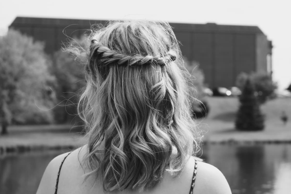 Young woman's hair styled with a wavy half-up twist